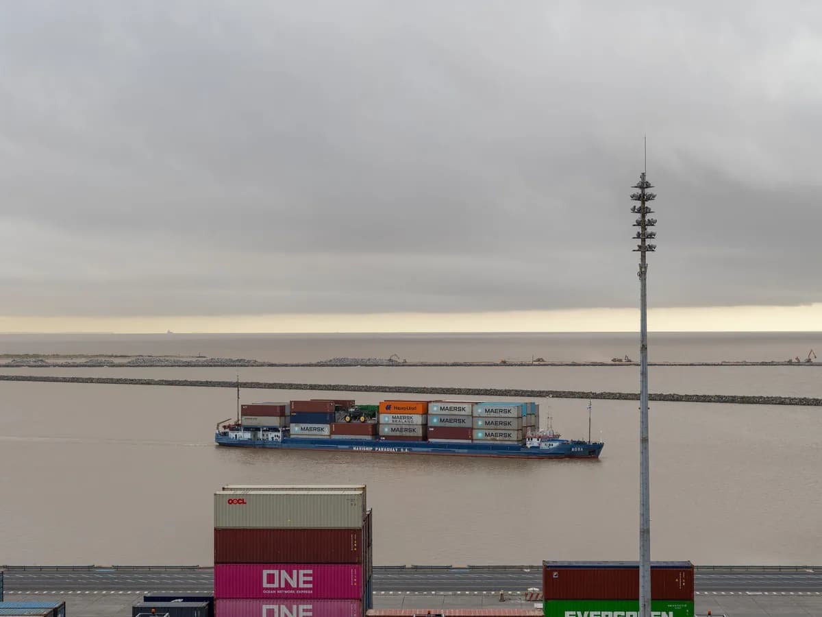 Cargo vessel and containers at a commercial shipping terminal