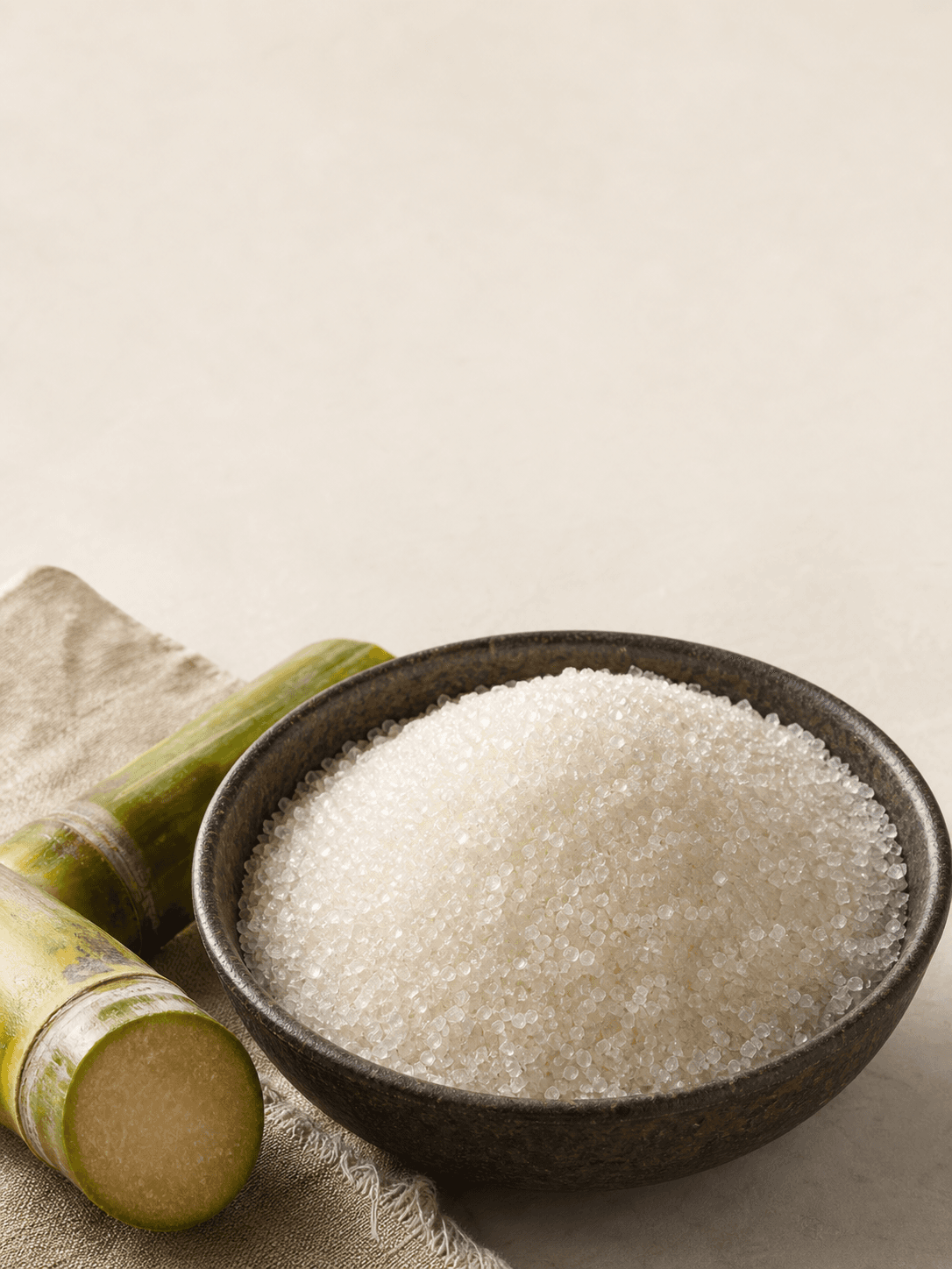 Warm white crystal cane sugar with cut sugar cane