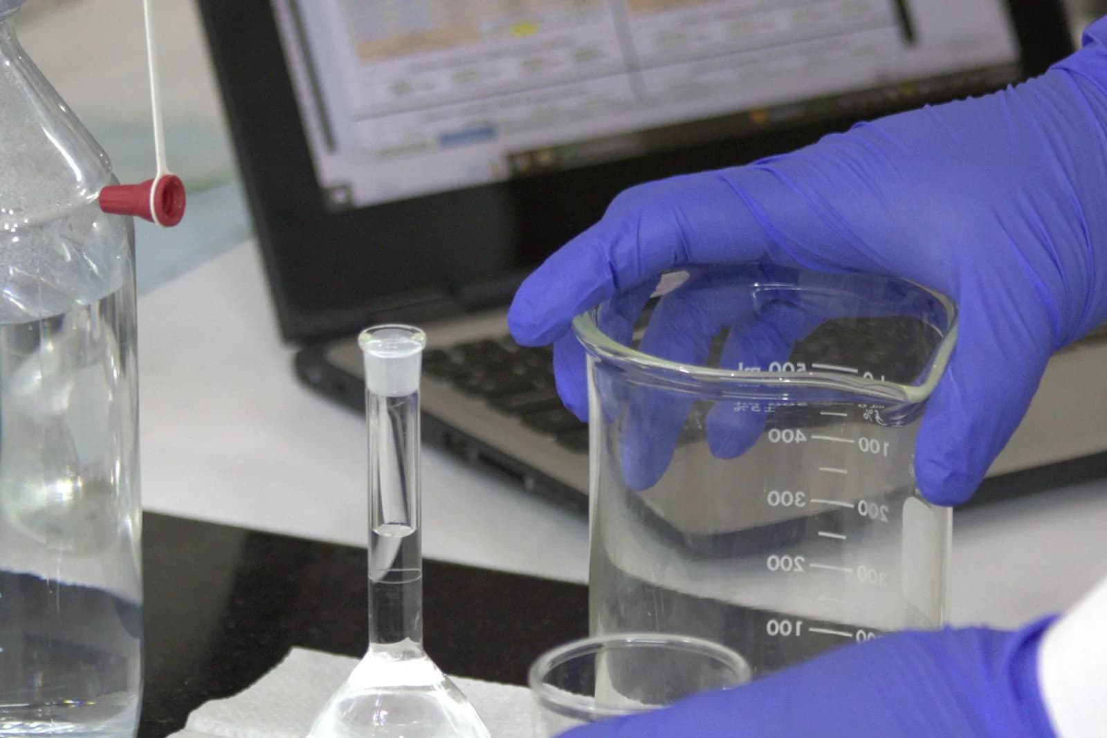 Laboratory technician preparing a sample for technical analysis