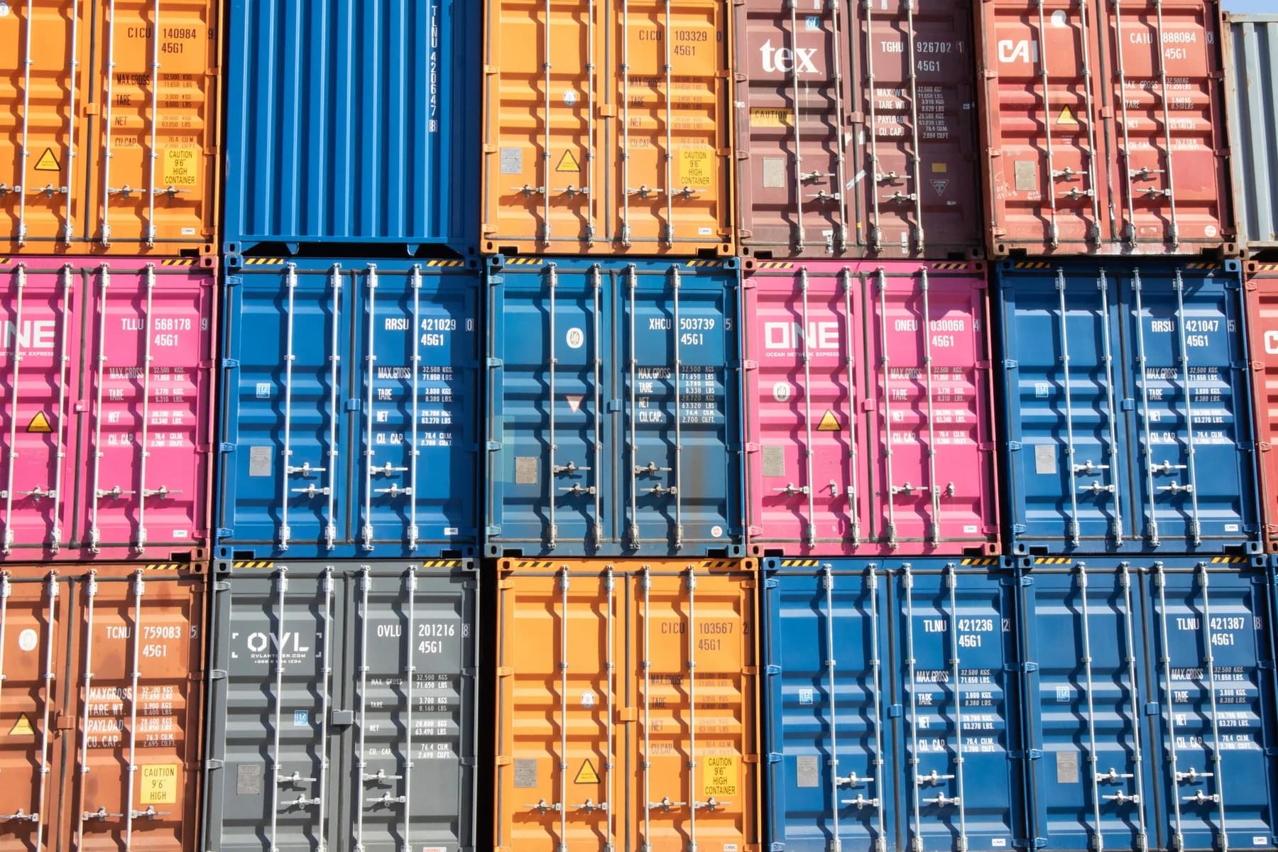 Brightly coloured containers arranged for international transport