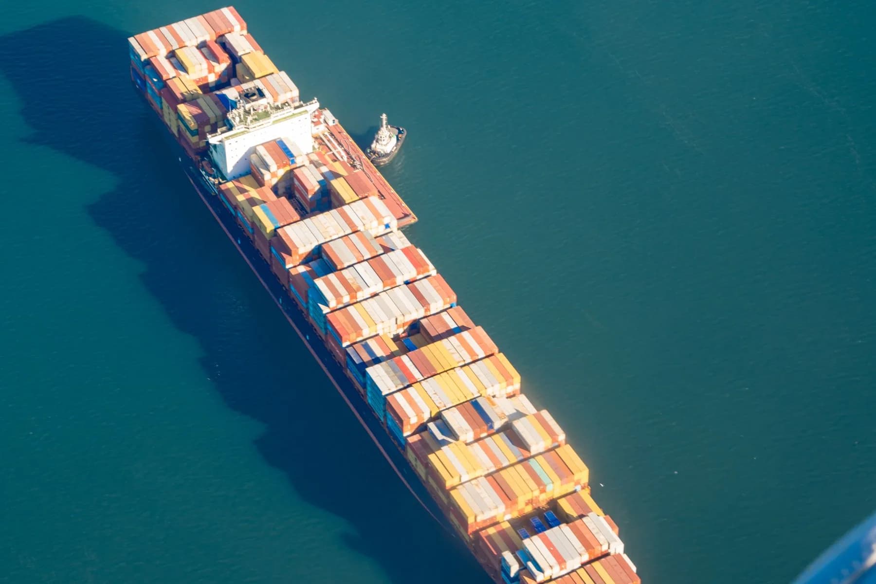 Container vessel on open water representing a structured commercial route