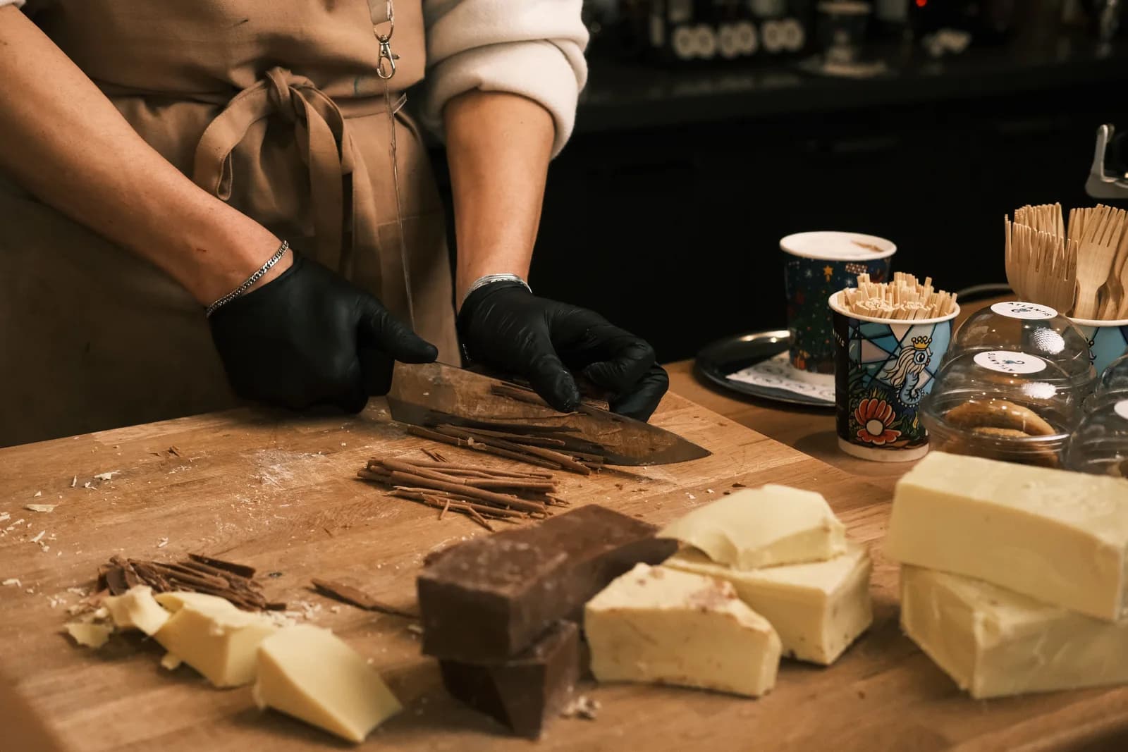 Chocolatier preparing cocoa-based ingredients for a finished application