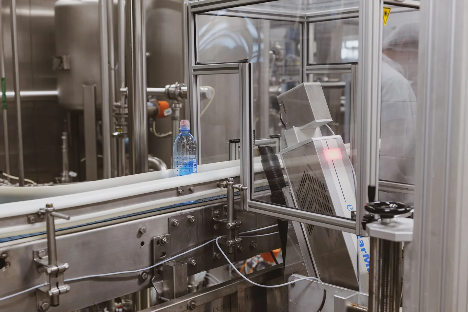 Bottles moving through a European food processing line