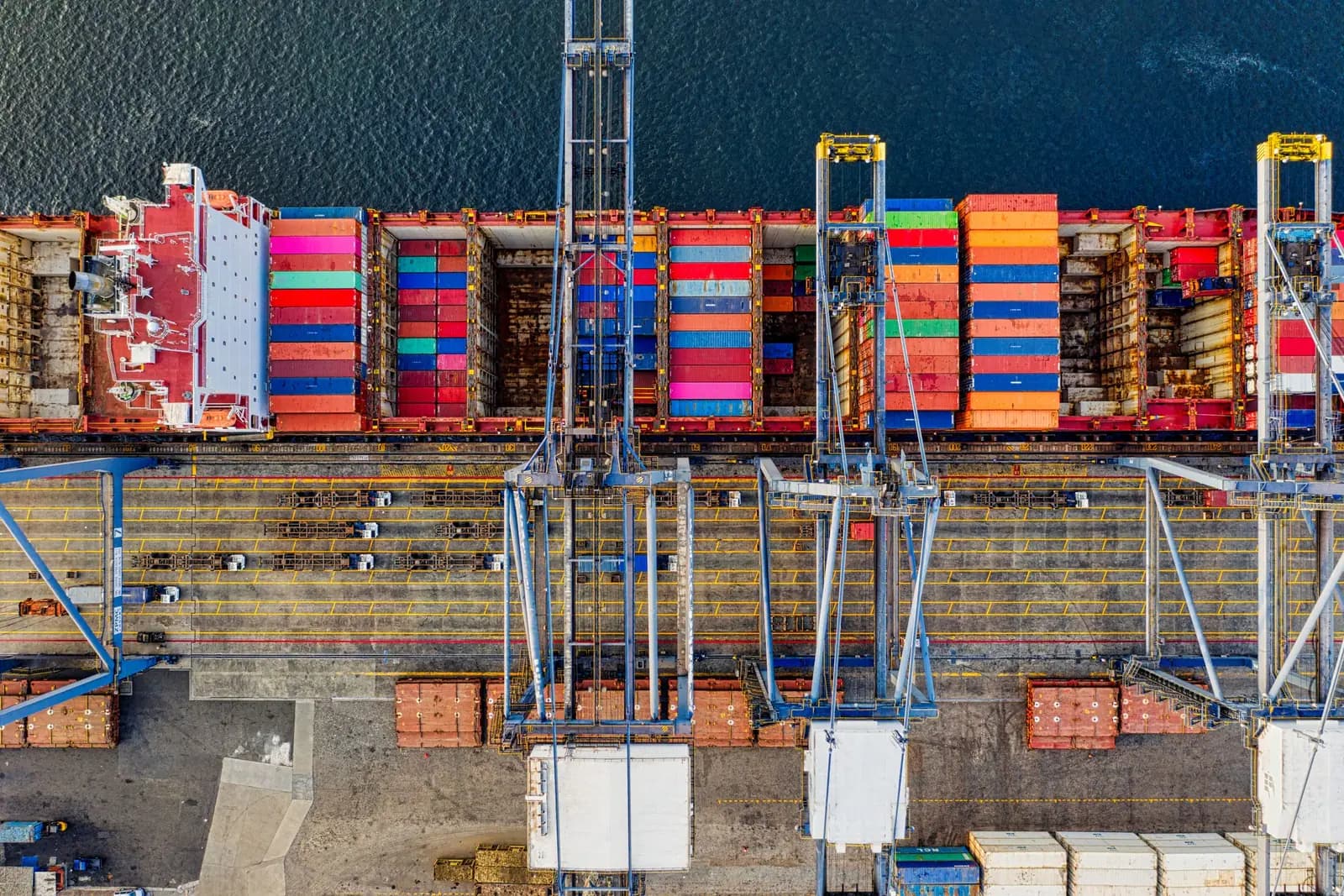 Aerial view of cargo containers and port infrastructure supporting global distribution